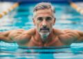 man in his late fifties swimming to keep fit